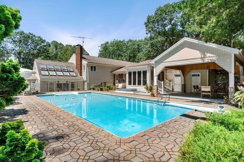 27 Rutgers Road Andover, MA 01810 - Photo 31 of 42 a view of a house with swimming pool and porch with furniture