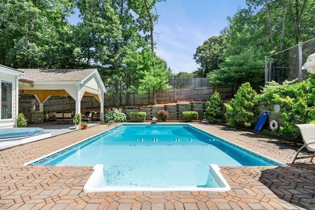 27 Rutgers Road Andover, MA 01810 - Photo 32 of 42 a view of a swimming pool with lounge chair