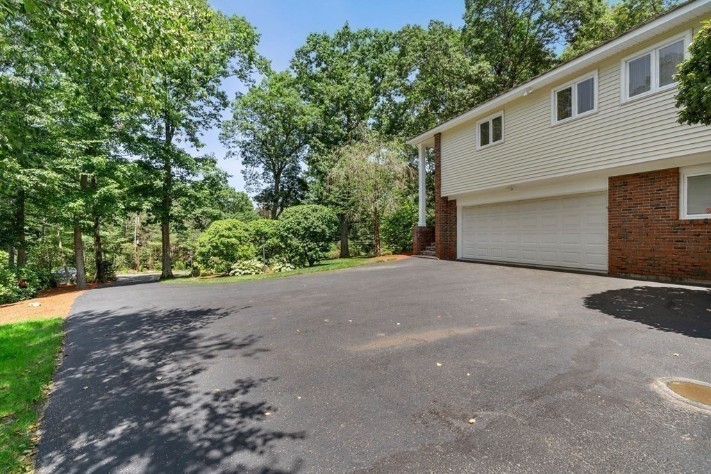 27 Rutgers Road Andover, MA 01810 - Photo 36 of 42 a view of a house with a yard and garage