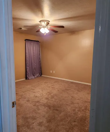 a view of a room with a wardrobe space
