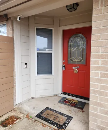 a front view of a house with a gate