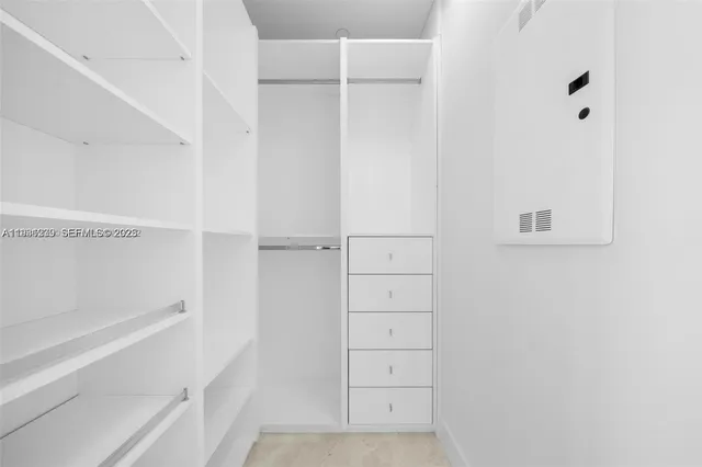 a utility room with sink washer and dryer