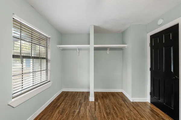 a view of wooden floor in an empty room