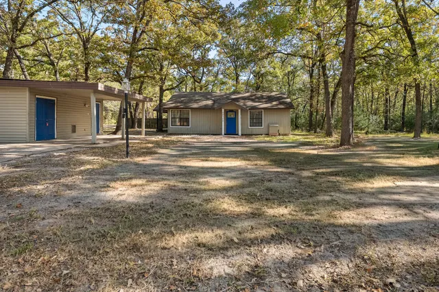 a backyard of a house with lots of green space
