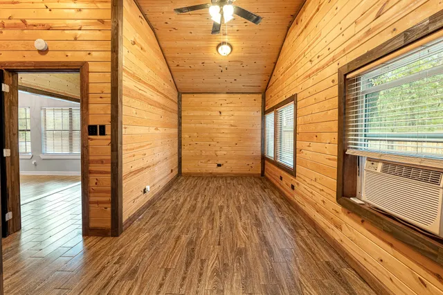 a view of a balcony with wooden floor