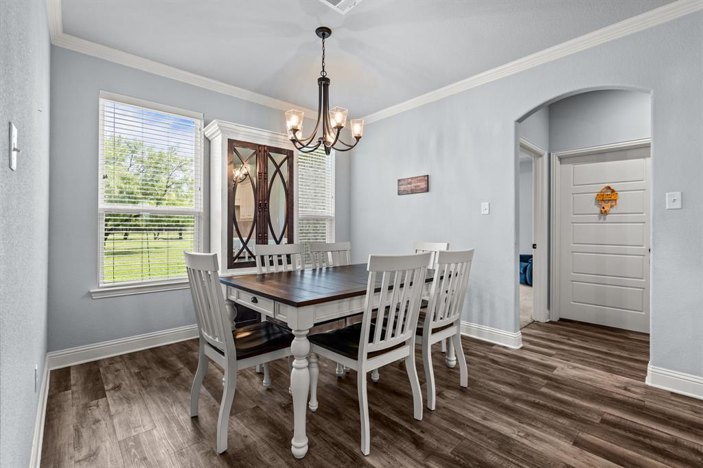 560 Wilson Bend Road Millsap, TX 76066 - Photo 19 of 38 Great dining space with views to the backyard and natural light.