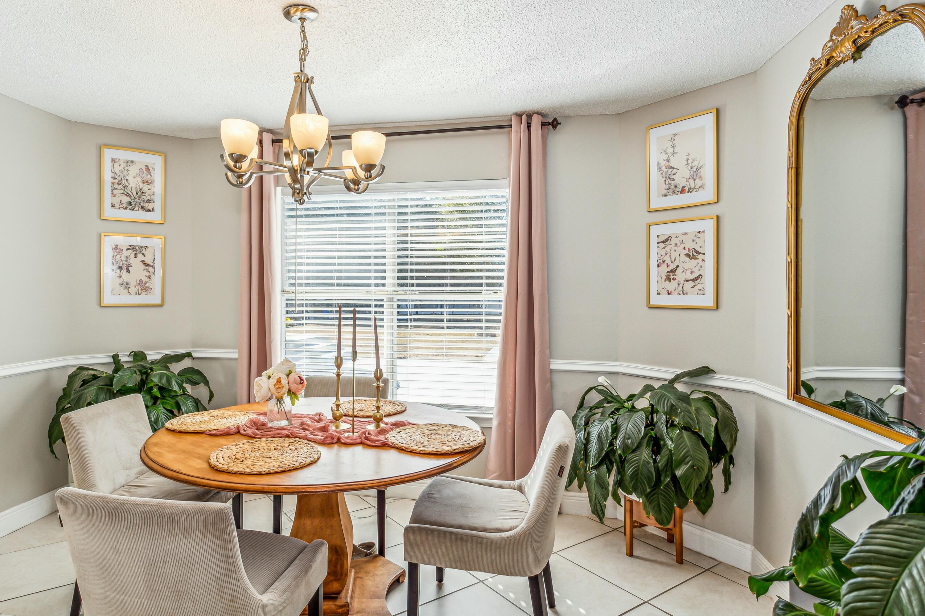 4741 Coronado Circle Crestview, FL 32539 - Photo 11 of 35 a view of a dining room with furniture and wooden floor
