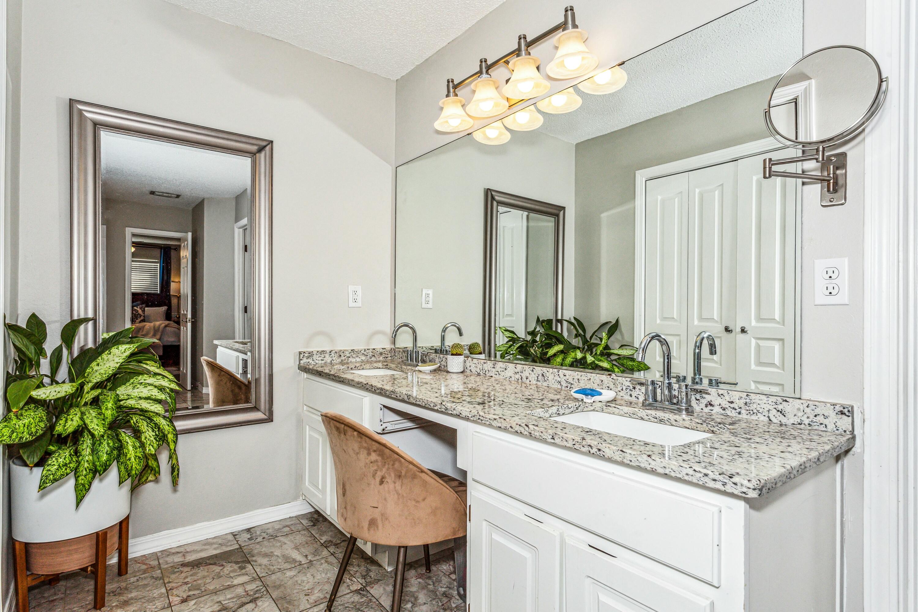 4741 Coronado Circle Crestview, FL 32539 - Photo 18 of 35 a bathroom with a sink and a mirror