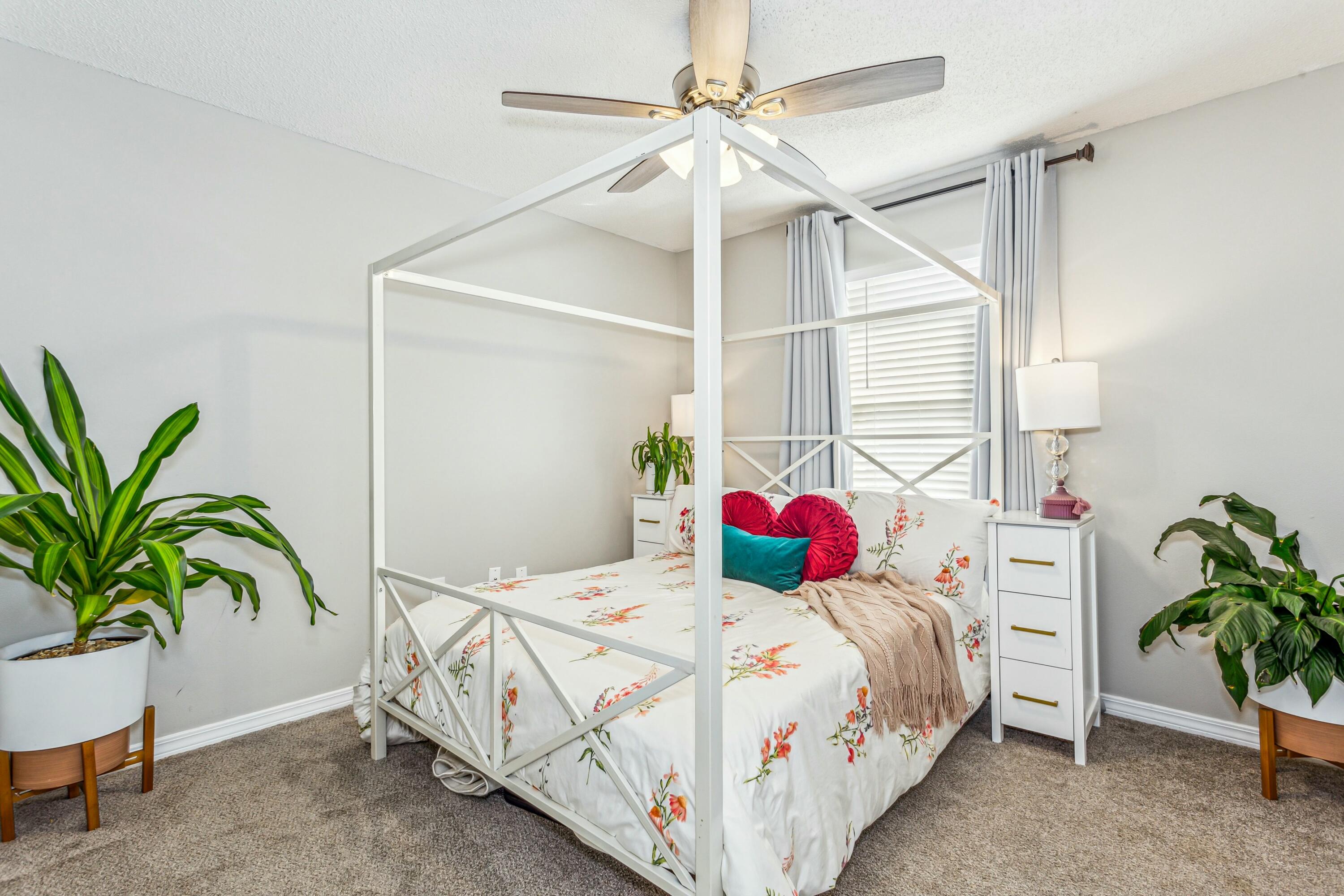 4741 Coronado Circle Crestview, FL 32539 - Photo 21 of 35 a bedroom with a bed and a potted plant