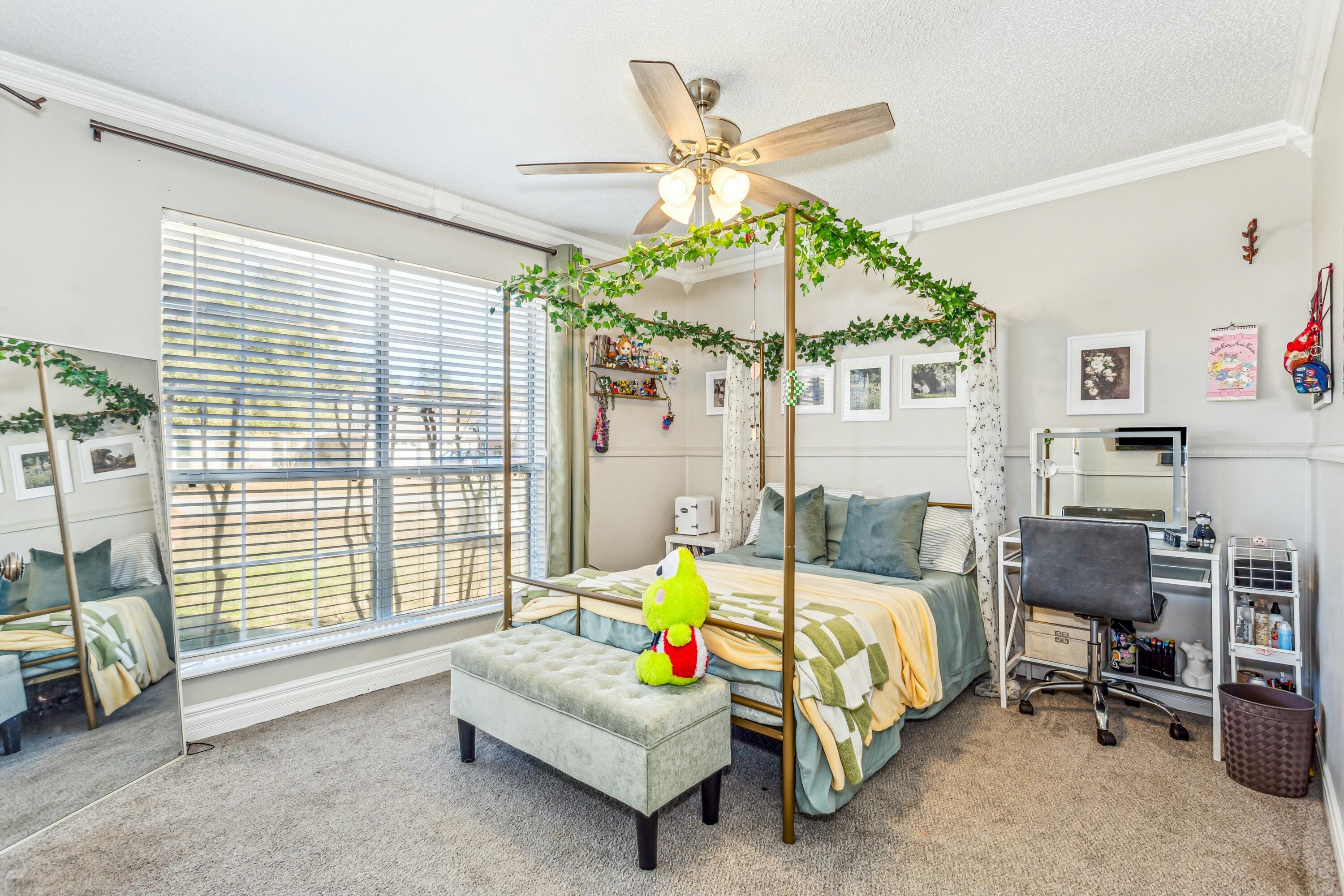 4741 Coronado Circle Crestview, FL 32539 - Photo 22 of 35 a bedroom with a bed and a chandelier
