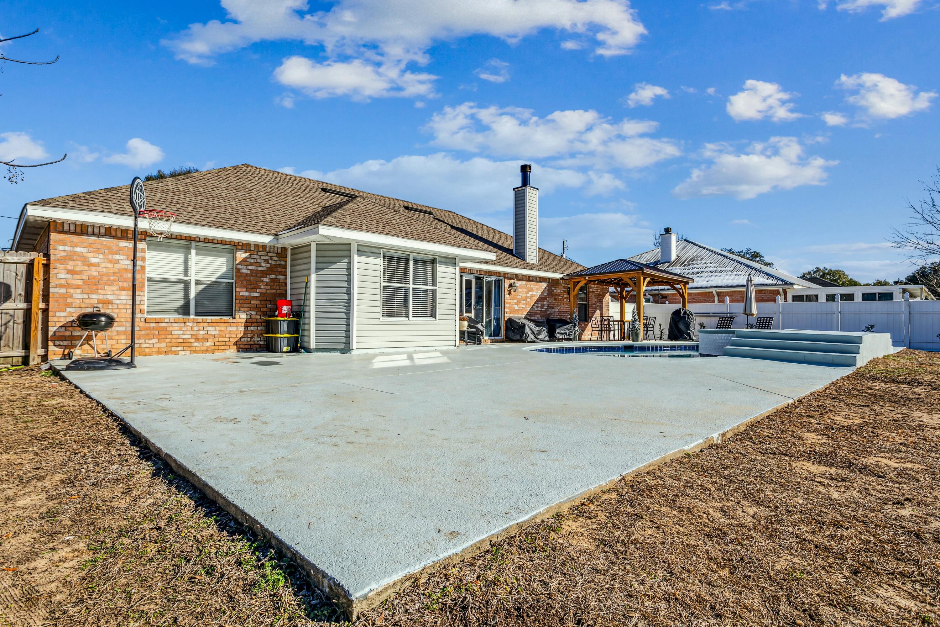 4741 Coronado Circle Crestview, FL 32539 - Photo 27 of 35 a view of a house with a swimming pool