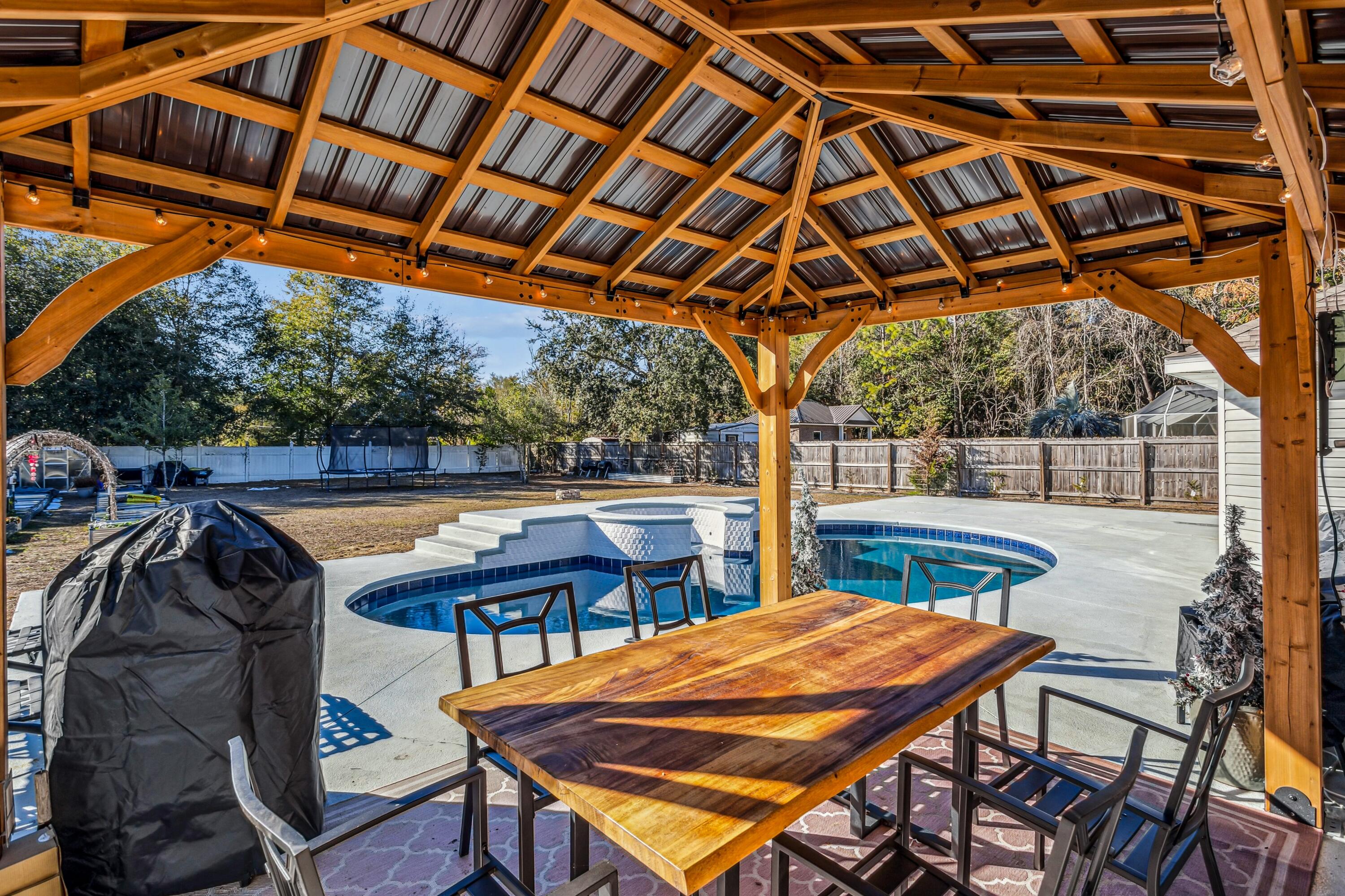 4741 Coronado Circle Crestview, FL 32539 - Photo 29 of 35 a outdoor view with a sitting space and large trees
