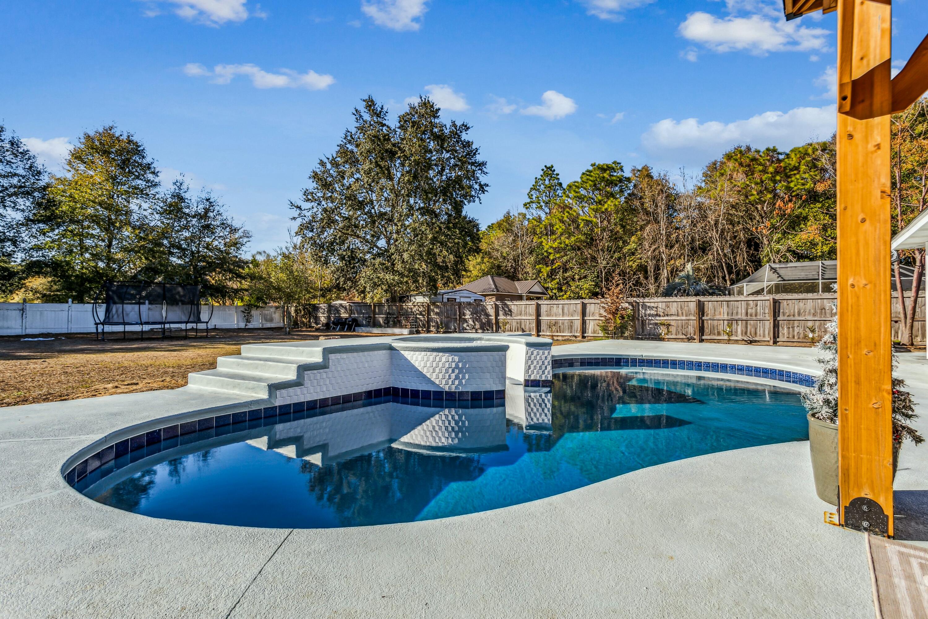 4741 Coronado Circle Crestview, FL 32539 - Photo 3 of 35 a view of swimming pool with chairs