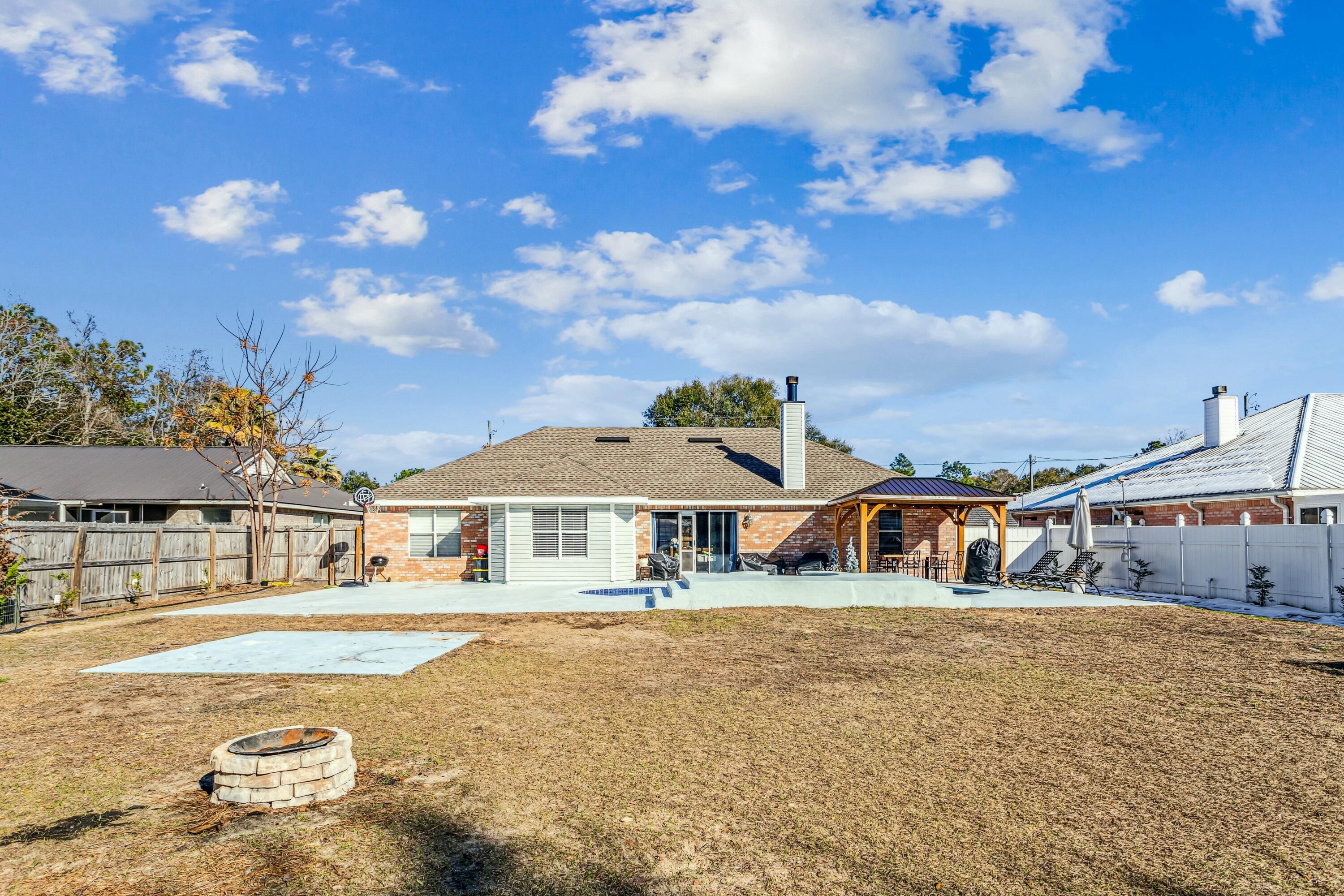 4741 Coronado Circle Crestview, FL 32539 - Photo 31 of 35 a front view of a house with a big yard