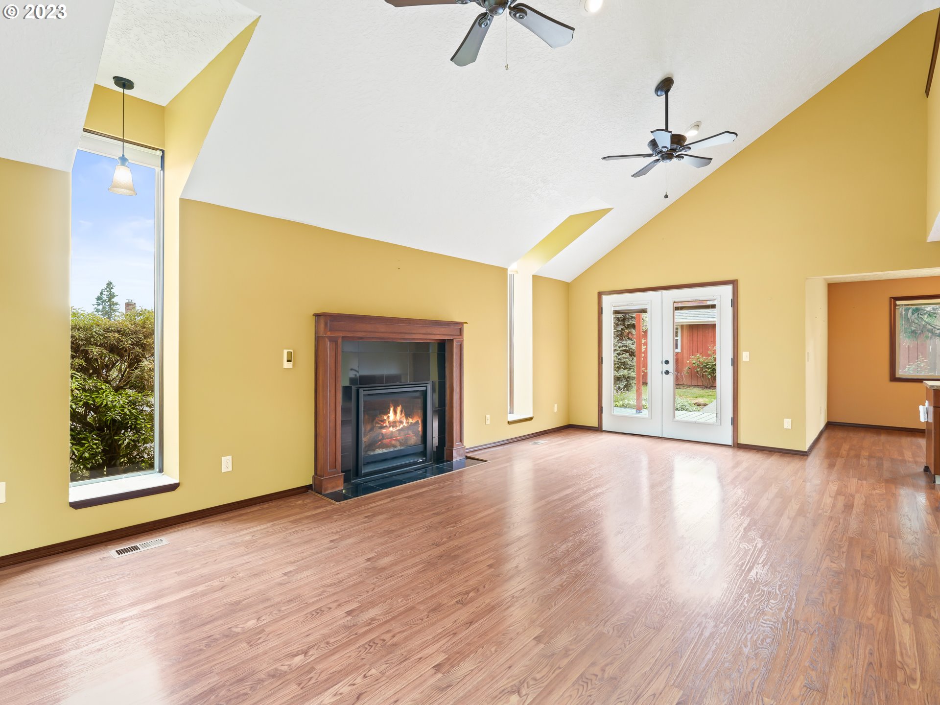 18320 Ross Avenue Sandy, OR 97055 - Photo 2 of 48 a view of an empty room with a window and fireplace