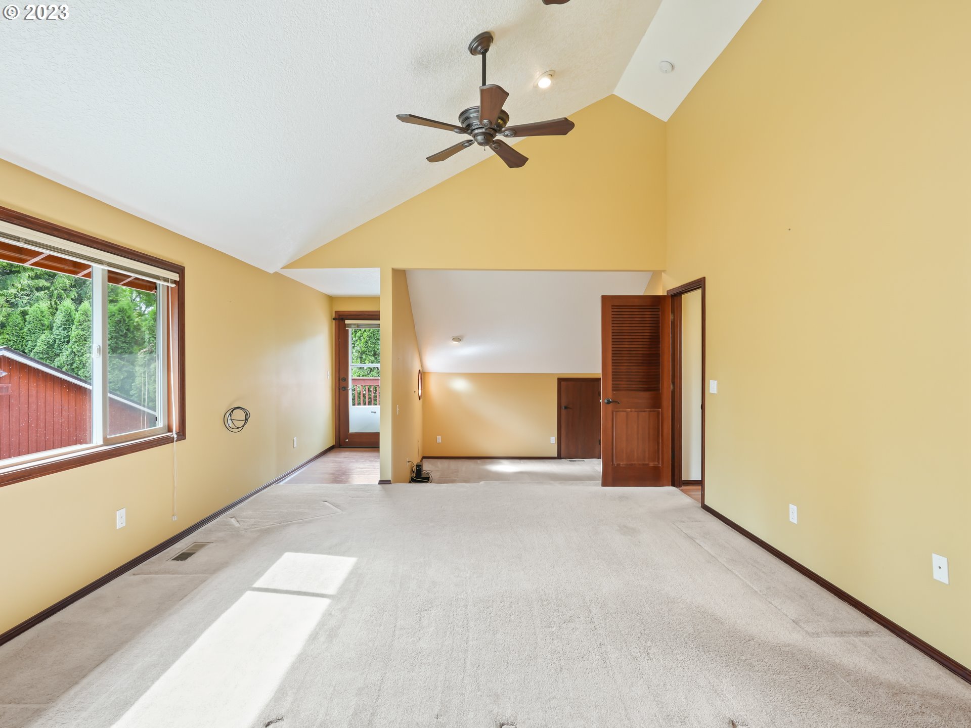 18320 Ross Avenue Sandy, OR 97055 - Photo 22 of 48 a view of a livingroom with a staircase and a ceiling fan