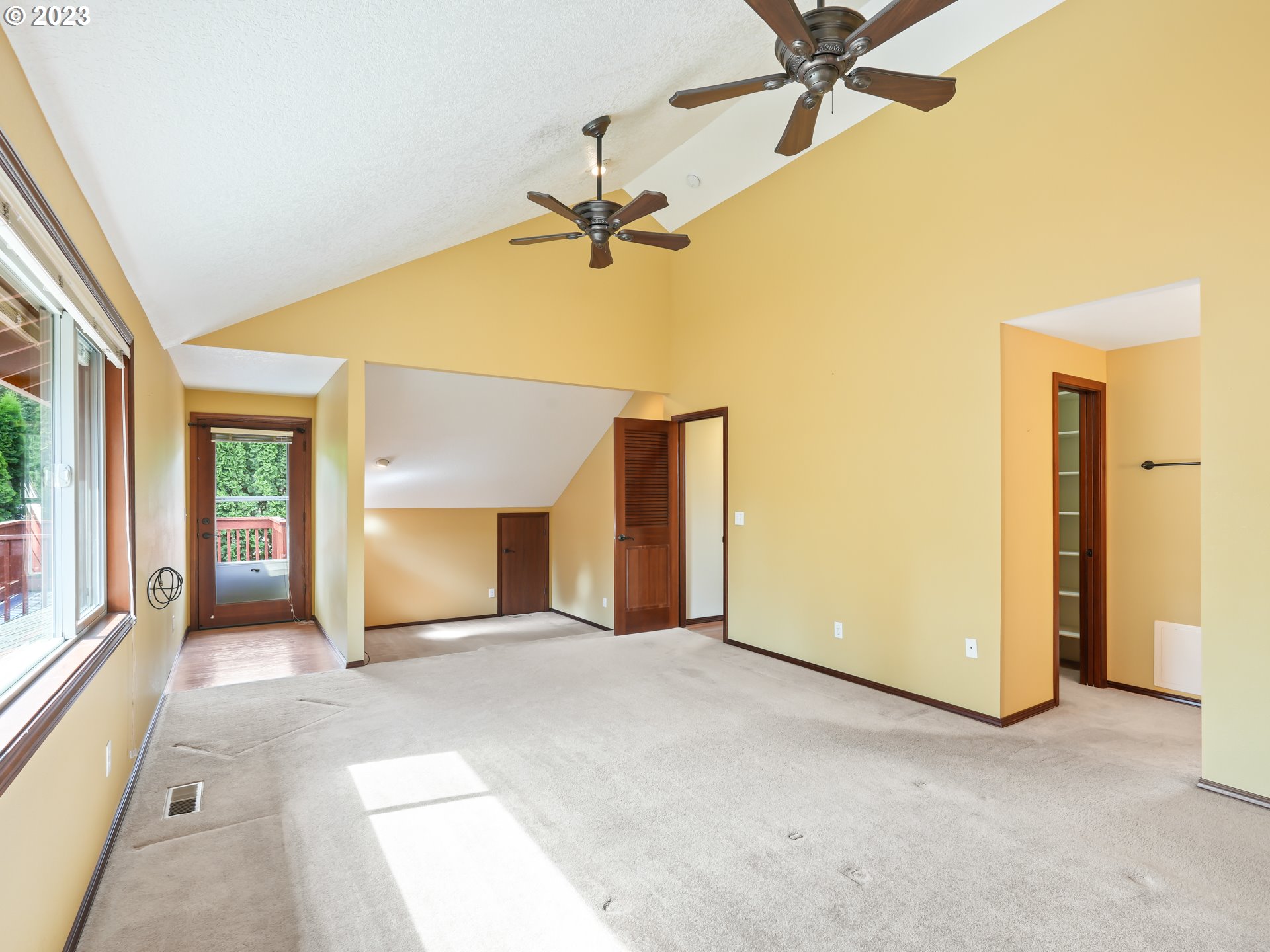 18320 Ross Avenue Sandy, OR 97055 - Photo 23 of 48 a view of a livingroom with a staircase a ceiling fan and a fireplace