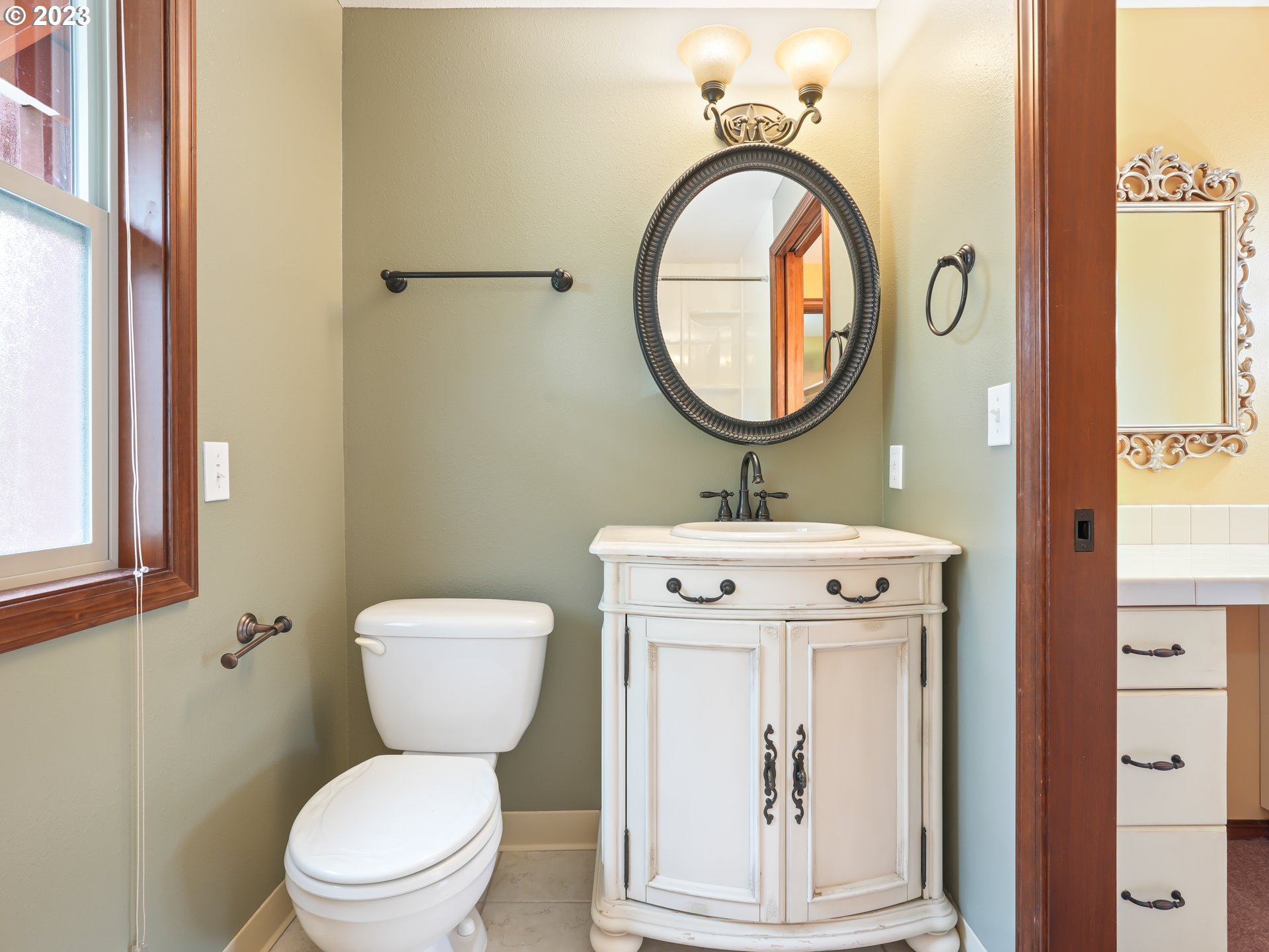 18320 Ross Avenue Sandy, OR 97055 - Photo 28 of 48 a bathroom with a toilet a sink and a mirror