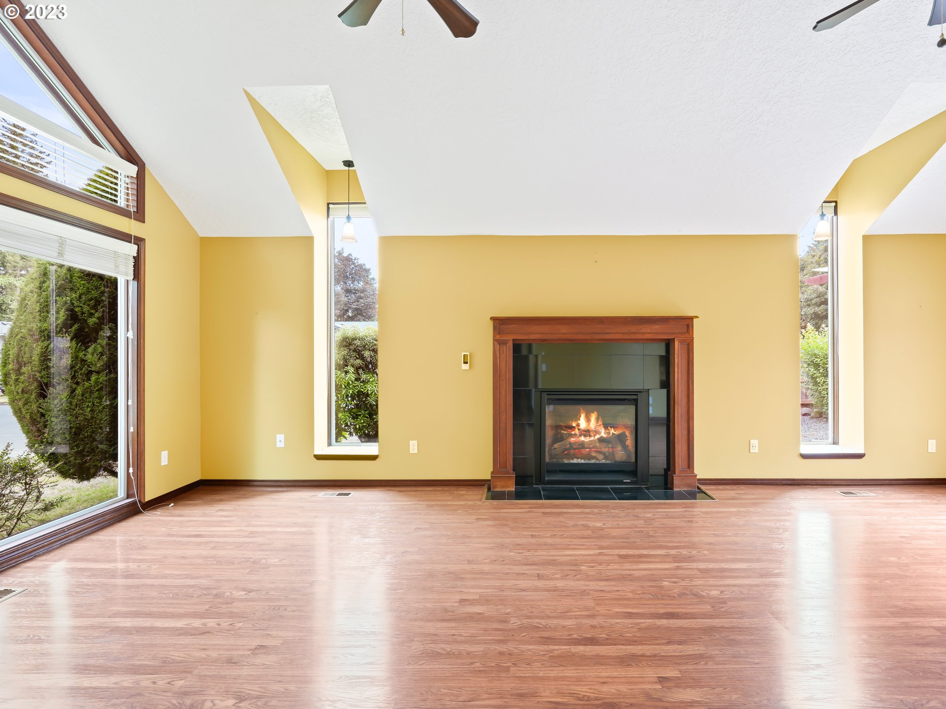 18320 Ross Avenue Sandy, OR 97055 - Photo 3 of 48 a view of an empty room with wooden floor and a window