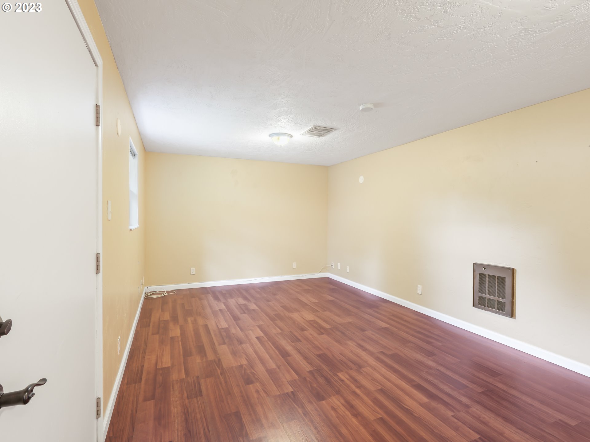 18320 Ross Avenue Sandy, OR 97055 - Photo 37 of 48 an empty room with wooden floor and windows