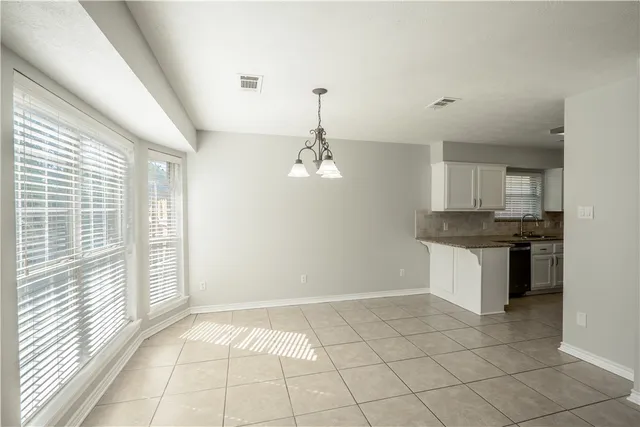 a view of a kitchen with a sink dishwasher and refrigerator