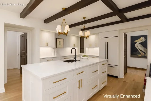 a kitchen with stainless steel appliances a refrigerator and cabinets