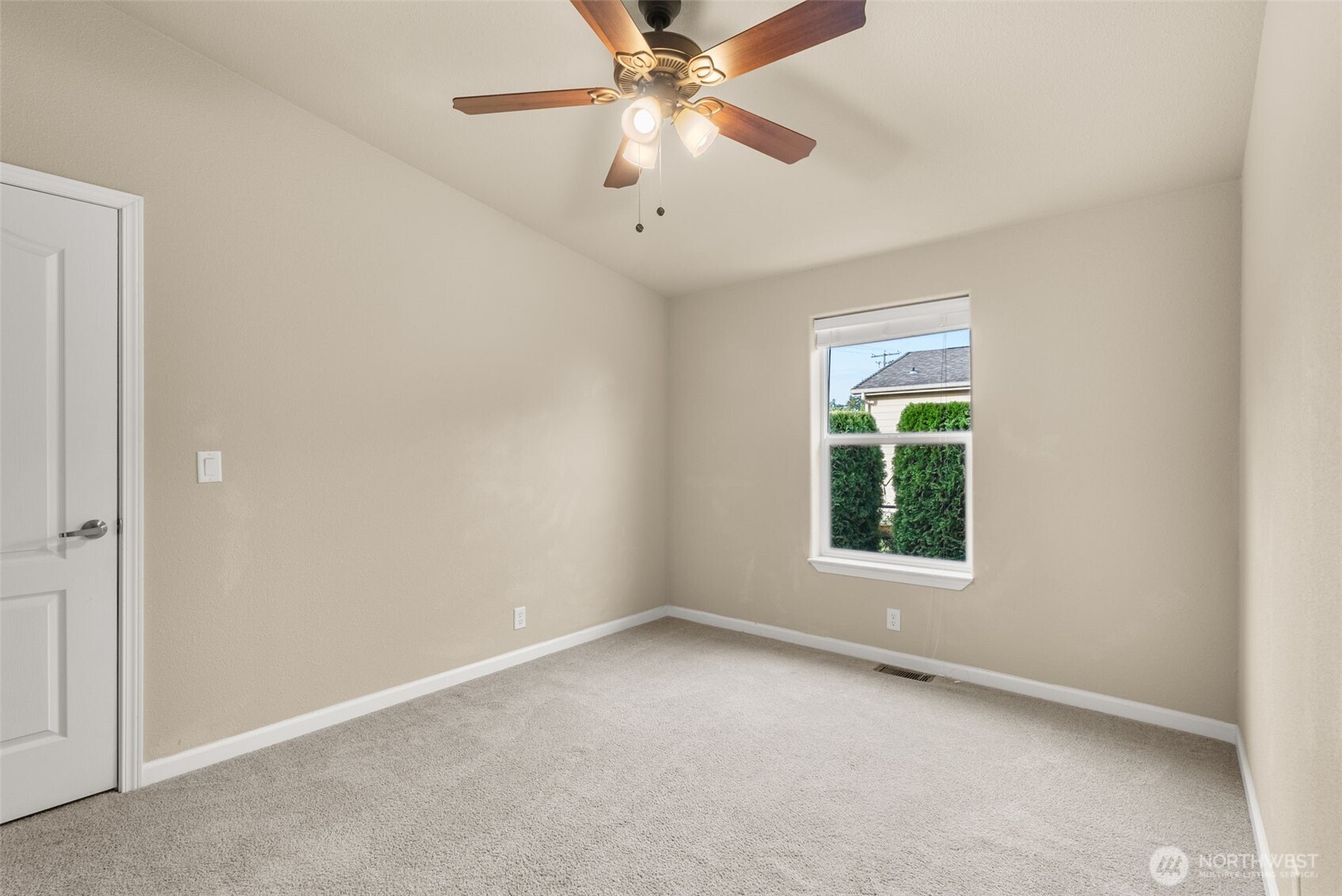 4259 Lakeview Lane Southeast, Unit 63 Lacey, WA 98503 - Photo 19 of 29 an empty room with a window and a fan