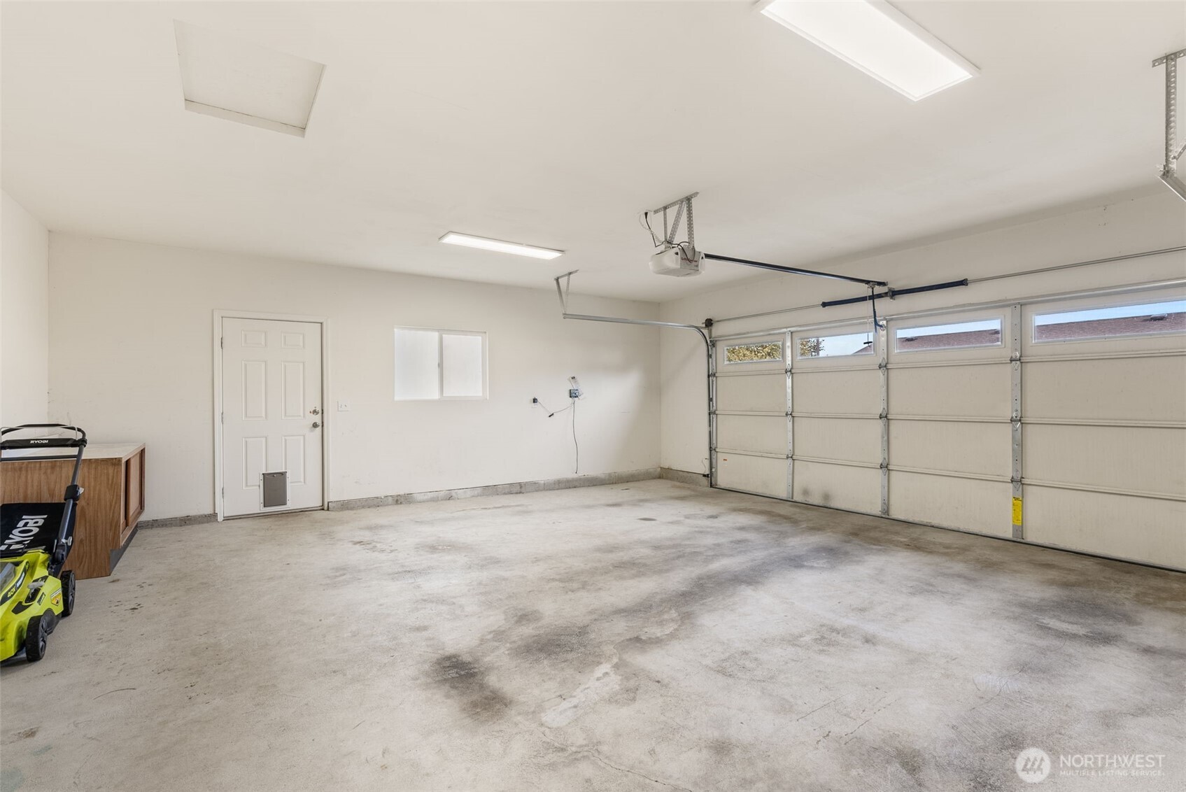 4259 Lakeview Lane Southeast, Unit 63 Lacey, WA 98503 - Photo 25 of 29 a view of a garage