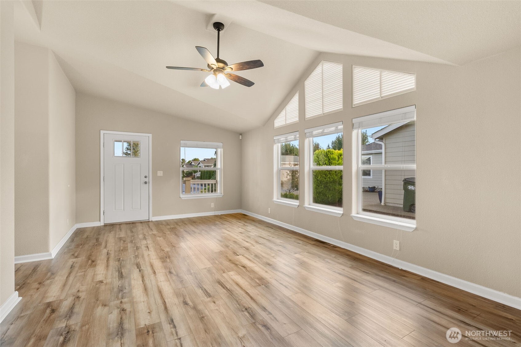 4259 Lakeview Lane Southeast, Unit 63 Lacey, WA 98503 - Photo 6 of 29 a view of an empty room with wooden floor and a window
