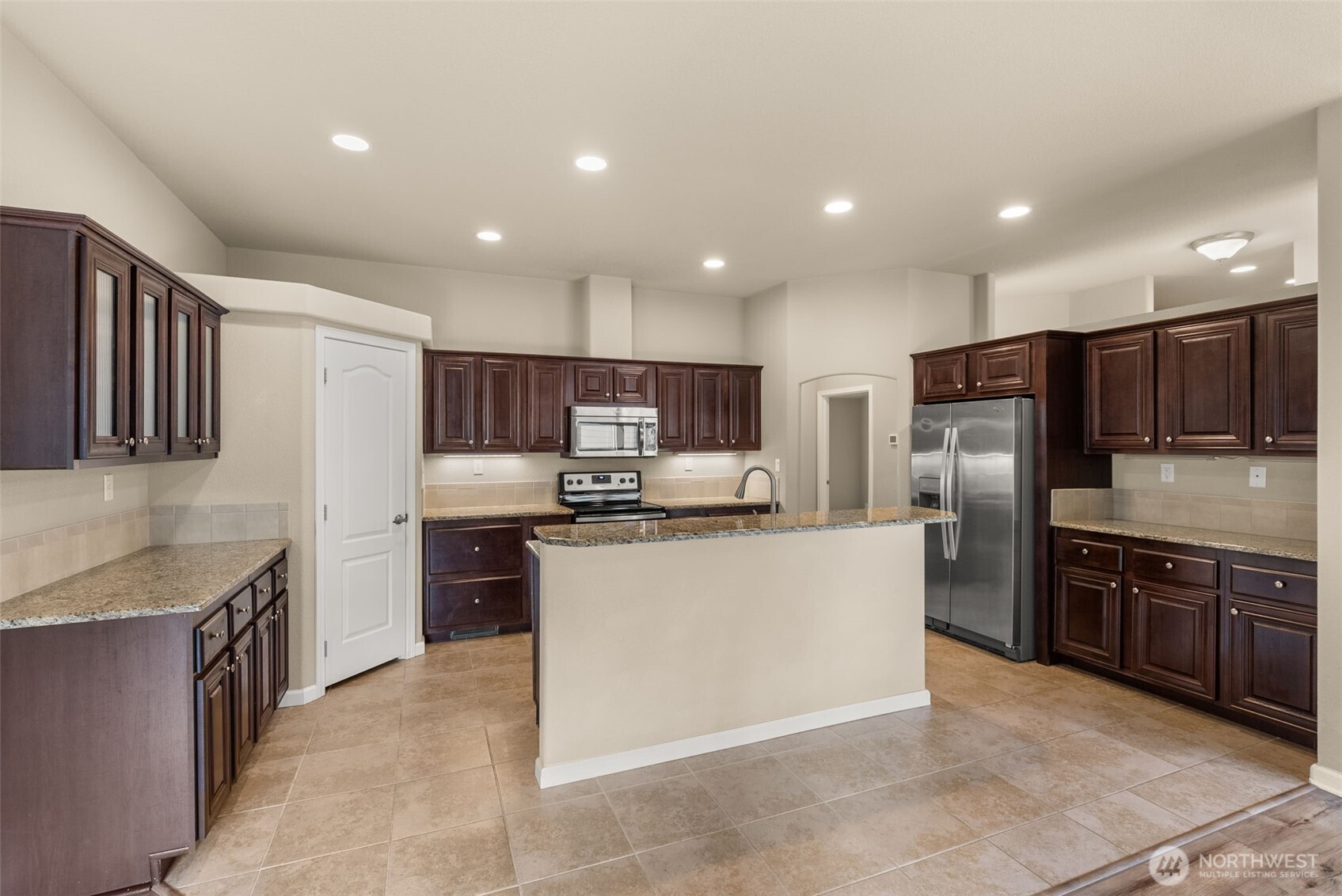4259 Lakeview Lane Southeast, Unit 63 Lacey, WA 98503 - Photo 7 of 29 a kitchen with stainless steel appliances granite countertop a refrigerator oven a sink dishwasher and a refrigerator