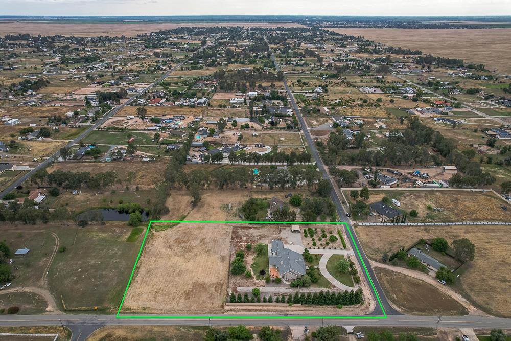 17465 Monreal Road Madera, CA 93636 - Photo 58 of 59 an aerial view of residential houses with outdoor space