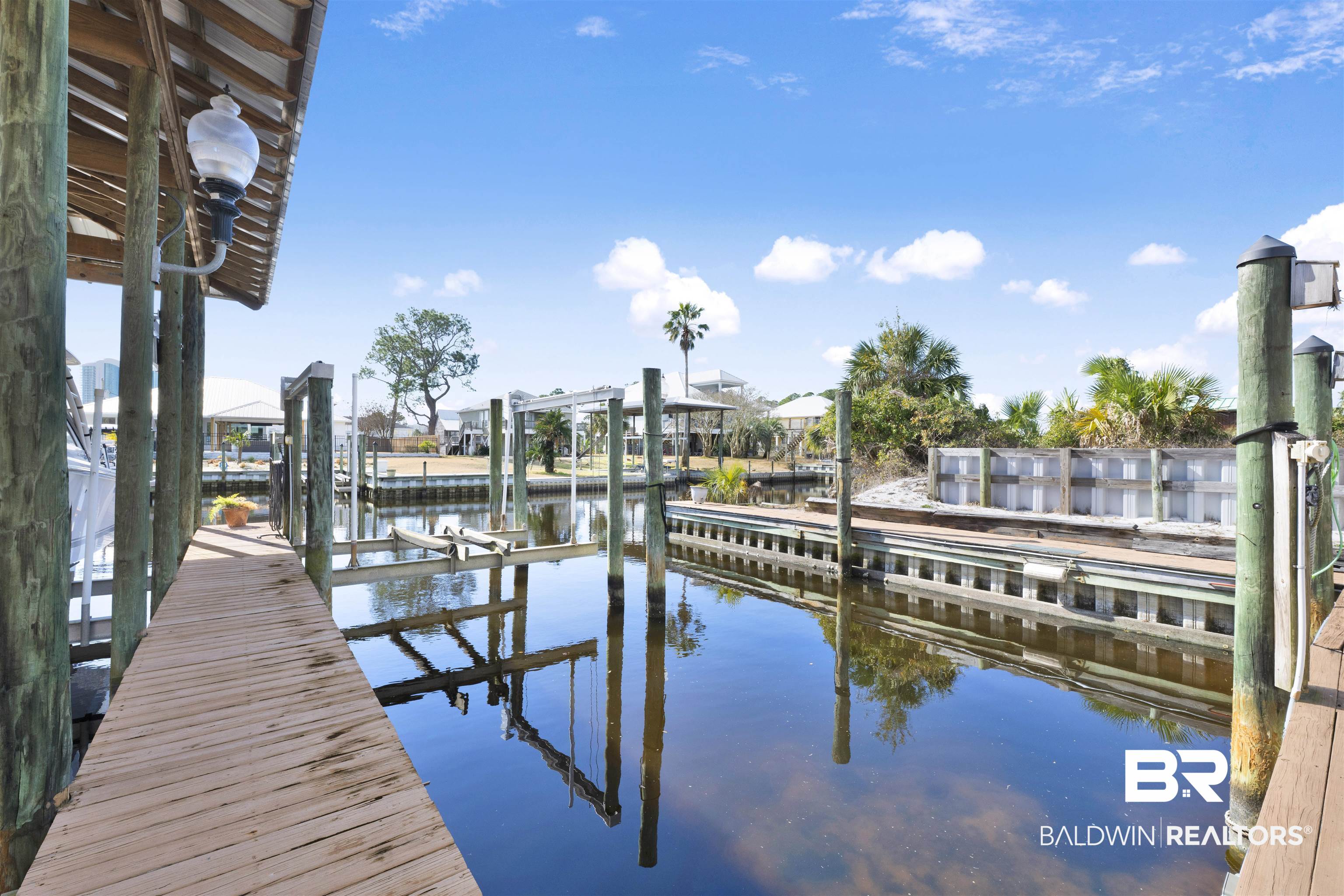 26222 Marina Road Orange Beach, AL 36561 - Photo 5 of 38 Dock area featuring boat lift and a water view