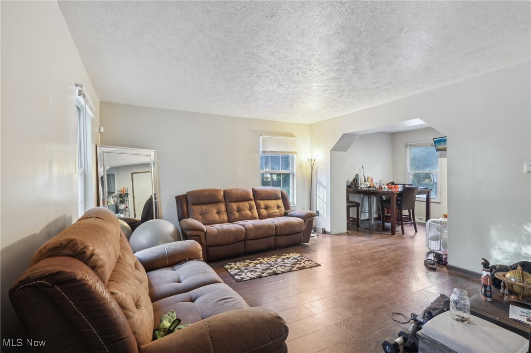 1042 Ansel Road Cleveland, OH 44103 - Photo 13 of 36 Living room with a textured ceiling and dark hardwood / wood-style flooring