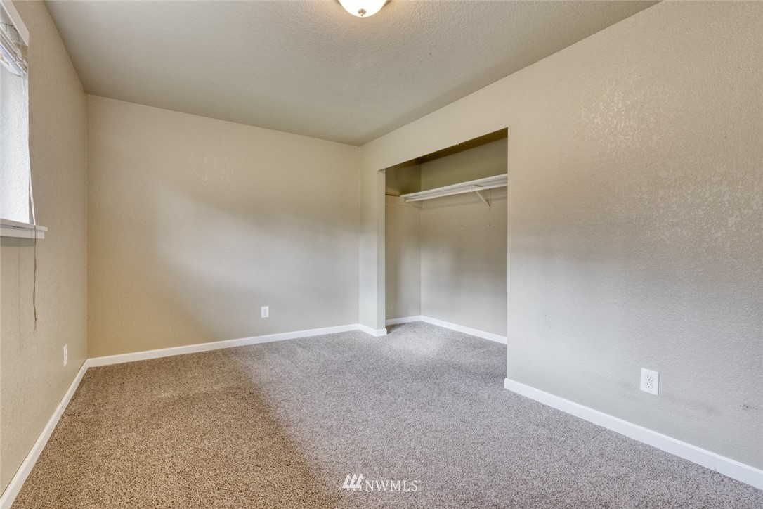17517 48th Street East Lake Tapps, WA 98391 - Photo 14 of 36 a view of an empty room with closet and a window