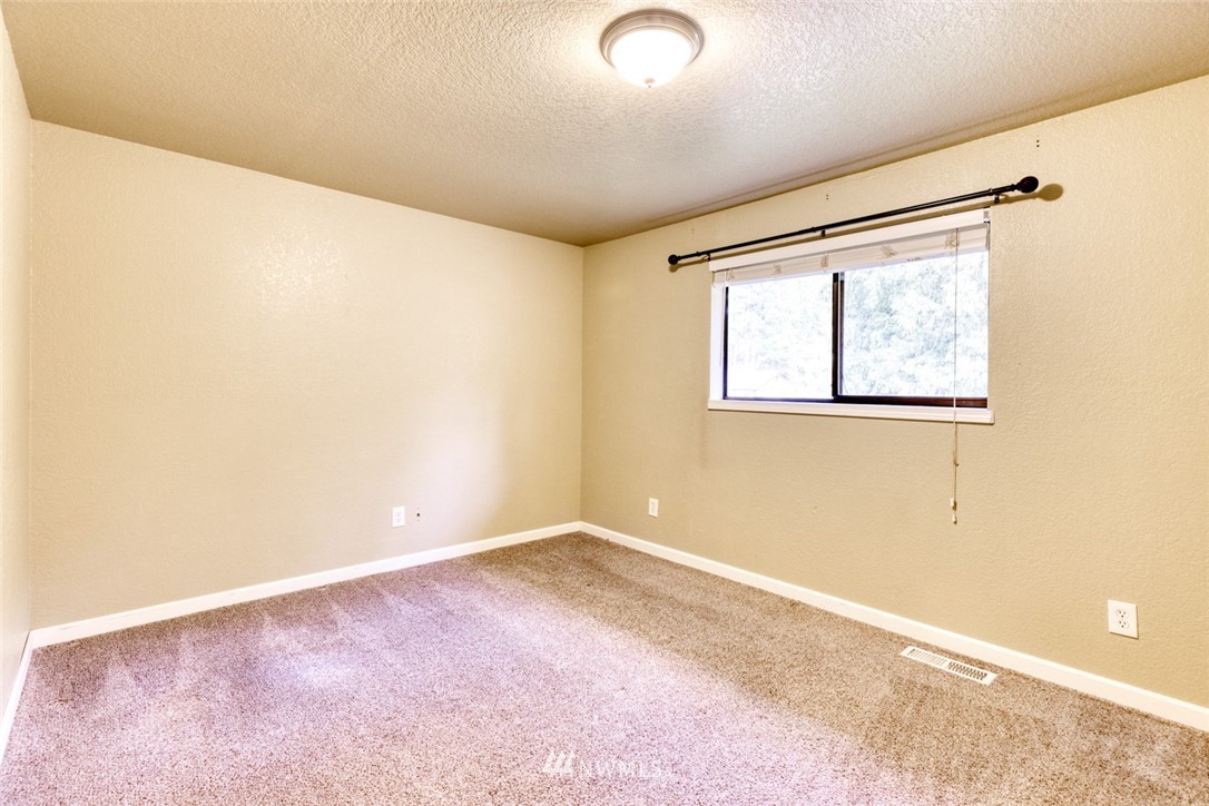17517 48th Street East Lake Tapps, WA 98391 - Photo 17 of 36 an empty room with windows