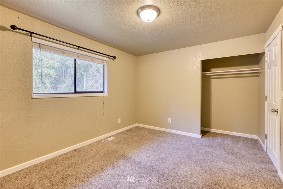 17517 48th Street East Lake Tapps, WA 98391 - Photo 18 of 36 an empty room with windows