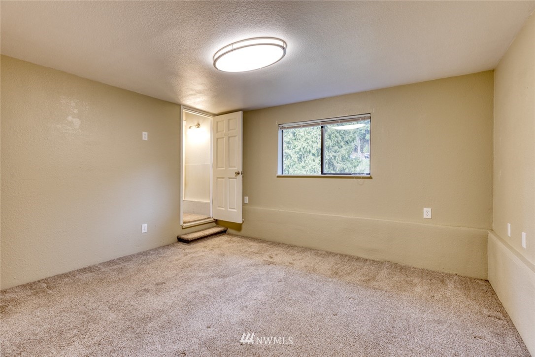 17517 48th Street East Lake Tapps, WA 98391 - Photo 21 of 36 a view of an empty room with a window