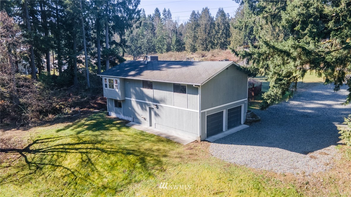17517 48th Street East Lake Tapps, WA 98391 - Photo 29 of 36 a view of a house with a yard and trees