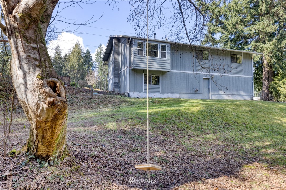 17517 48th Street East Lake Tapps, WA 98391 - Photo 31 of 36 a view of a house with a yard fire pit and a large tree