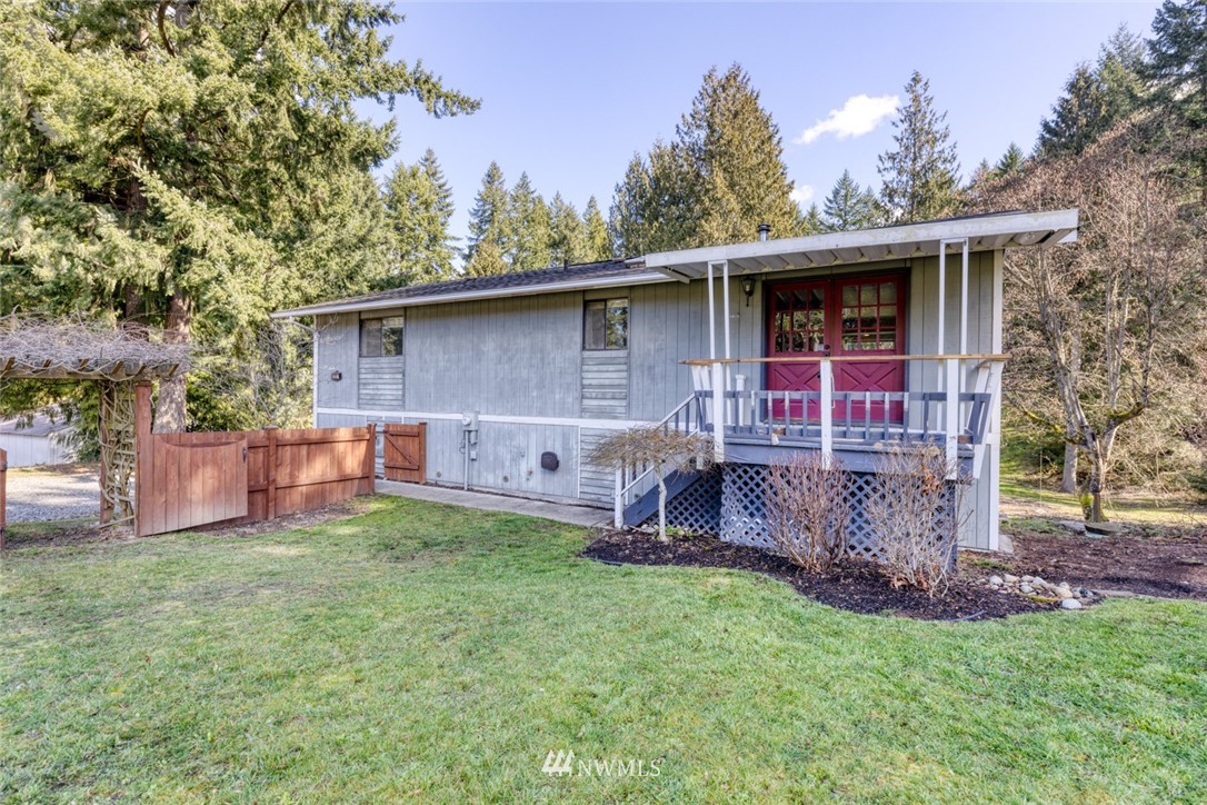 17517 48th Street East Lake Tapps, WA 98391 - Photo 33 of 36 a front view of a house with a yard and porch