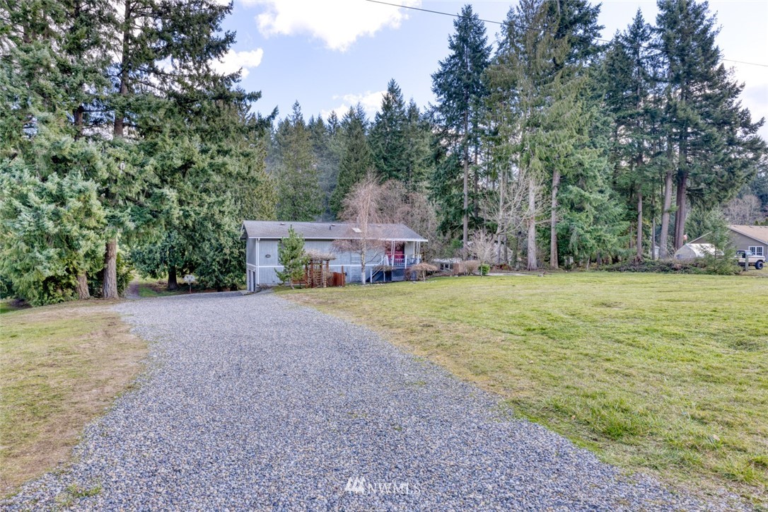 17517 48th Street East Lake Tapps, WA 98391 - Photo 36 of 36 a front view of a house with a yard and trees