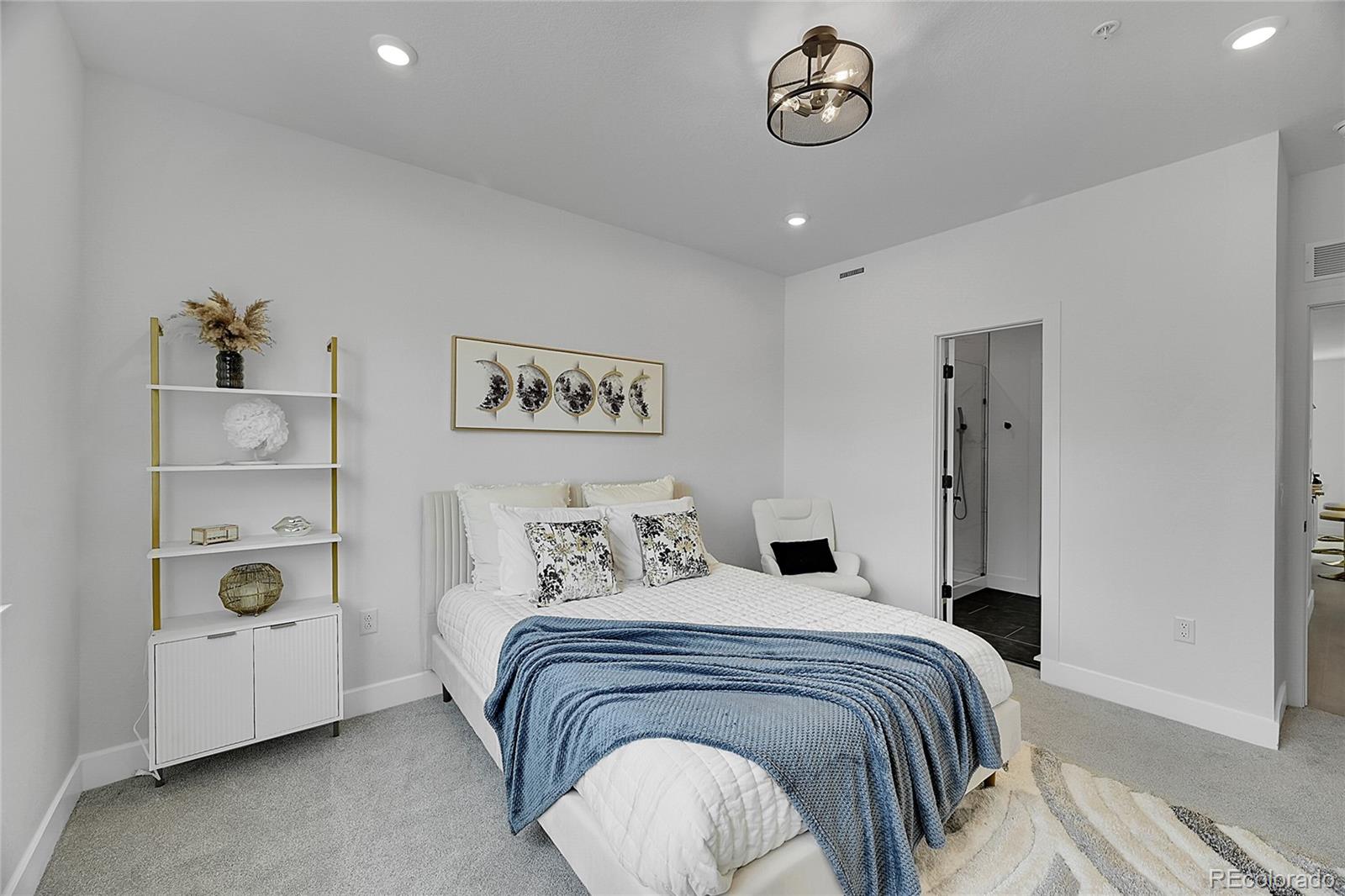 8530 West 52nd Avenue, Unit E3 Arvada, CO 80002 - Photo 11 of 27 a bedroom with a bed and a window