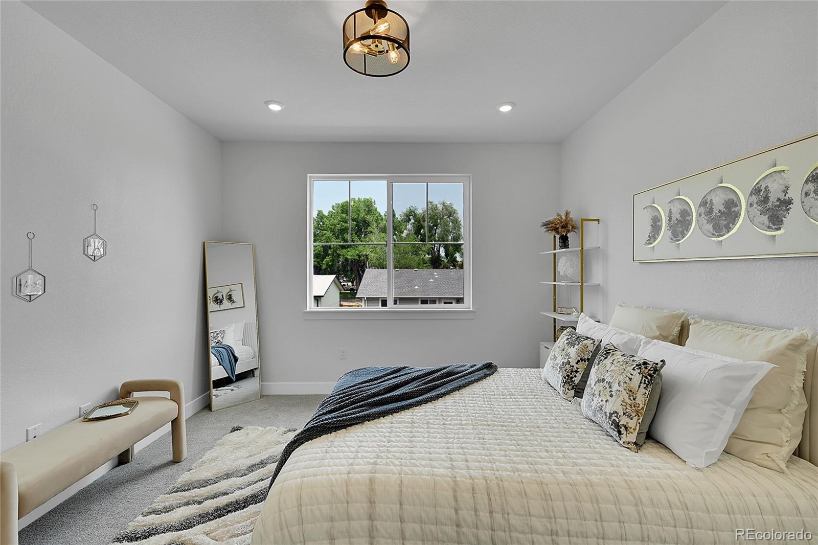 8530 West 52nd Avenue, Unit E3 Arvada, CO 80002 - Photo 12 of 27 a bedroom with a bed and a window