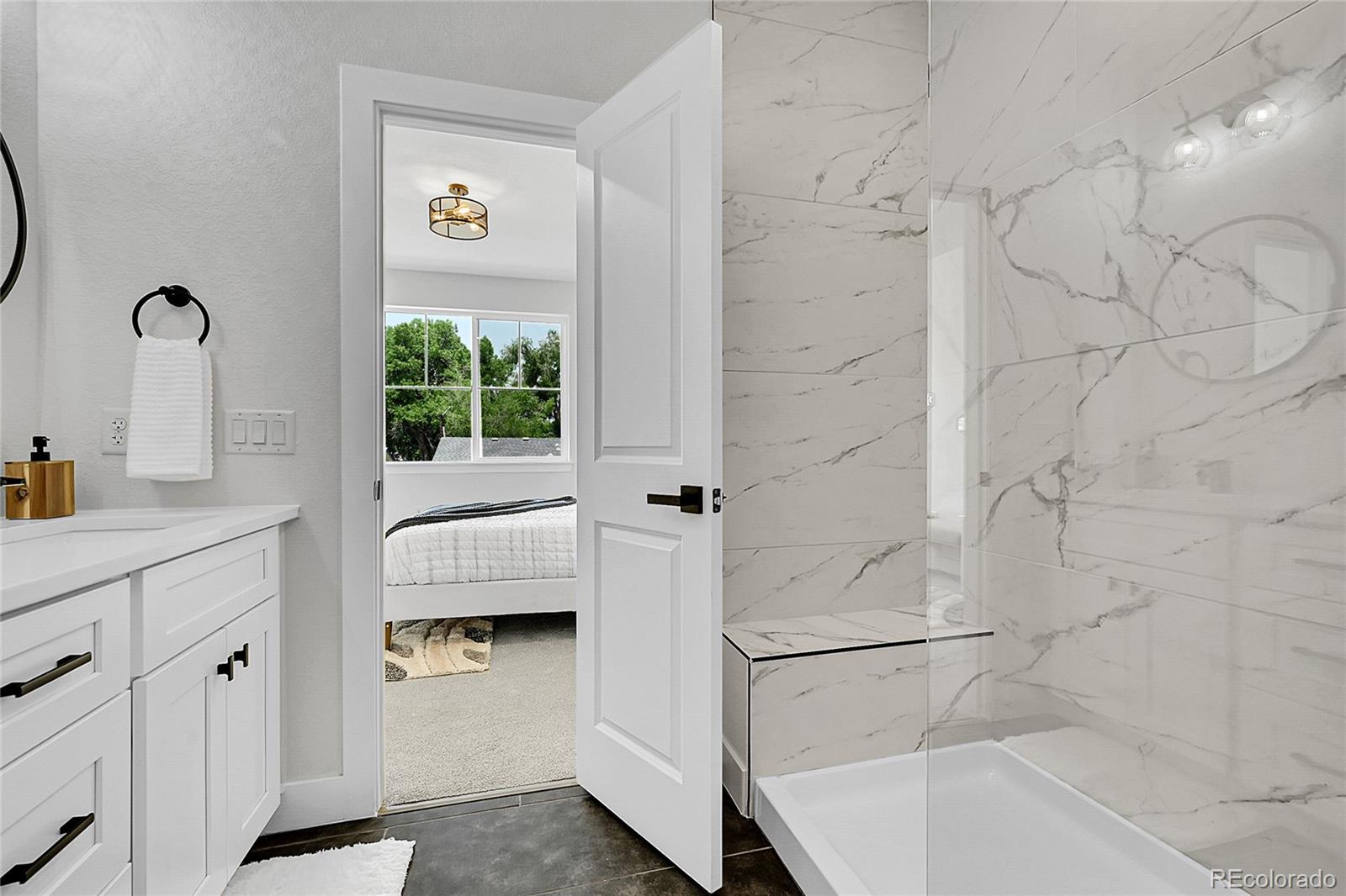 8530 West 52nd Avenue, Unit E3 Arvada, CO 80002 - Photo 14 of 27 a bathroom with a shower