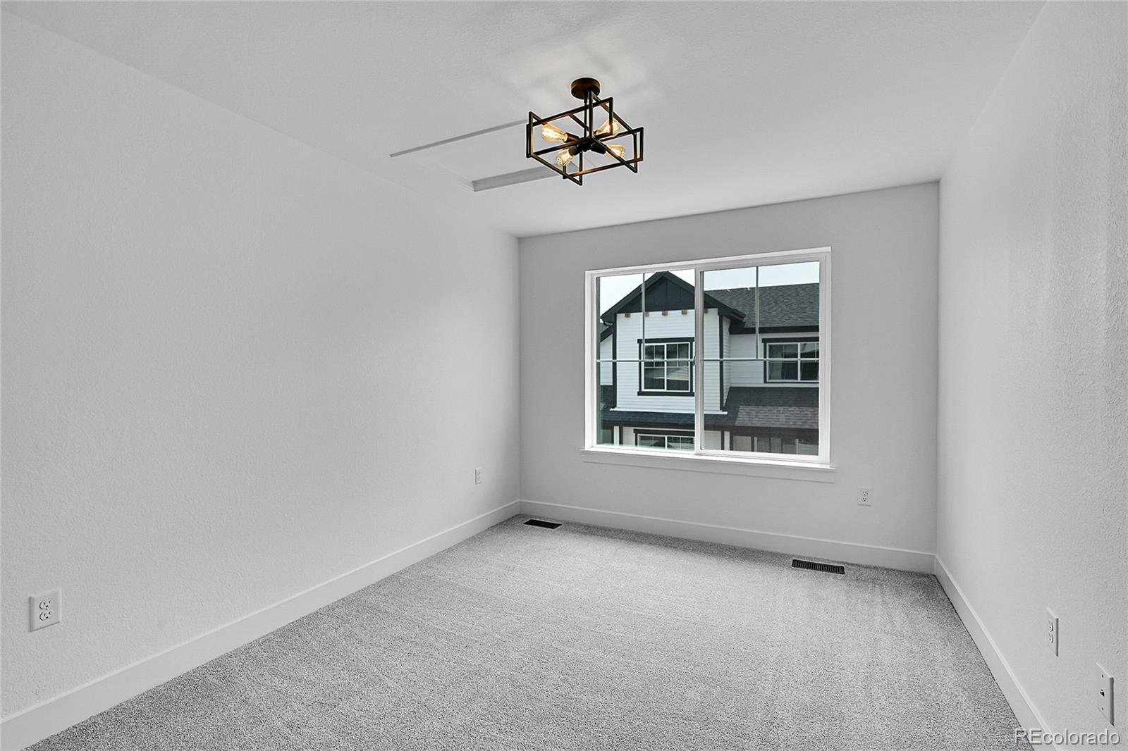 8530 West 52nd Avenue, Unit E3 Arvada, CO 80002 - Photo 22 of 27 an empty room with a window