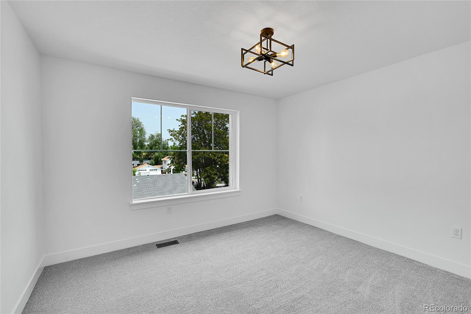 8530 West 52nd Avenue, Unit E3 Arvada, CO 80002 - Photo 25 of 27 a view of empty room with windows