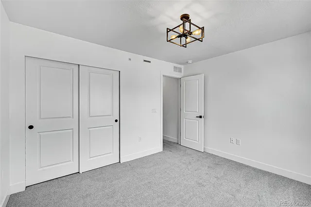 a front view of a house with a road