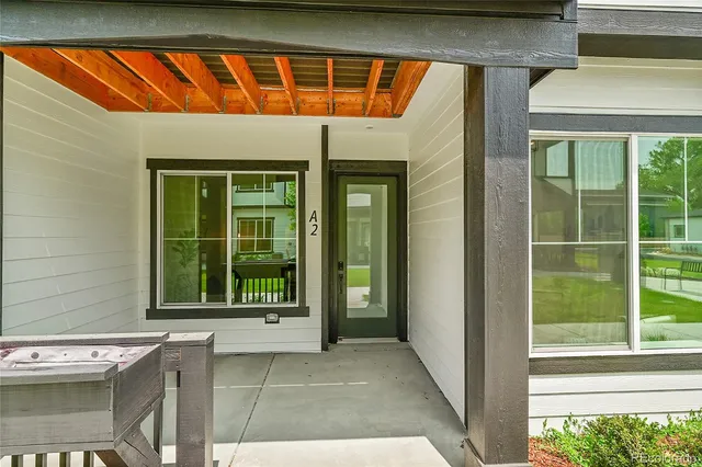 a front view of a house with a large window