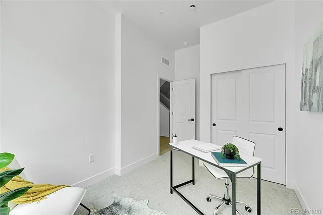 a white toilet sitting next to a bath tub