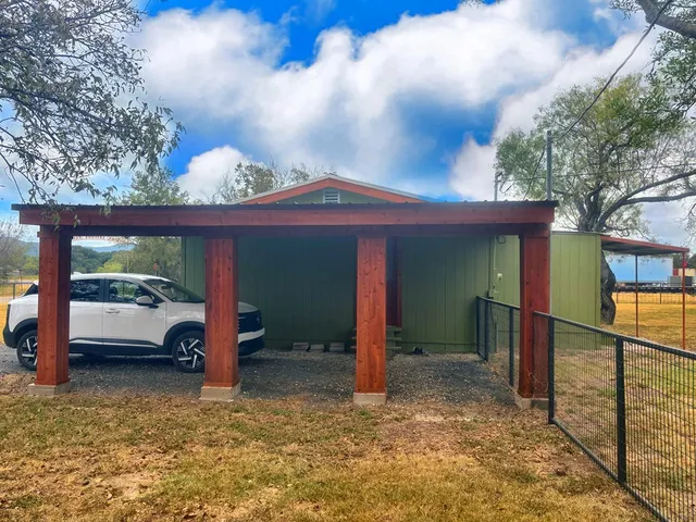 a house with trees in front of it